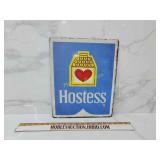 Hostess metal sign
