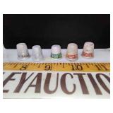 Antique advertising thimbles one is gasoline and