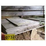 STACK OF PLYWOOD IN BARN