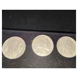 Three buffalo nickels