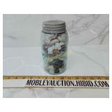 Antique jar full of polished rocks and more