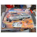 Slot car track with trucks