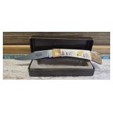 vintage folding pocket knife, scrimshaw-style art