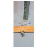 Silver unicorn cage pendant hangs from a 26in