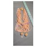 1950s multi-strand necklace features pale pink