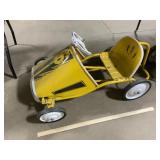Yellow pedal car