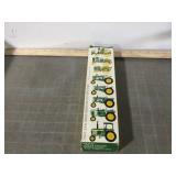 8 John Deere miniature toy tractors
