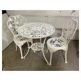 Wrought iron patio set w/24-1/2' round table & x