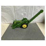 John Deere tractor with mounted corn picker