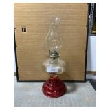 Antique kerosene lamp, red base