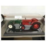 Oliver 440 & Co-op tractors in display case