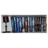 Clive Cussler books and candle holder