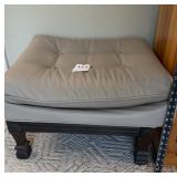 Ottoman with wooden legs