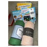 Throw blankets, drawing pad and toy plains