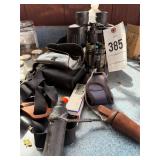 Binoculars, duck calls, marine band harmonica