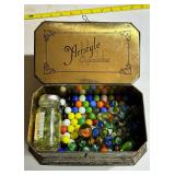 Marbles and vintage tin