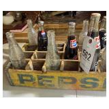 Pepsi crate and various soda bottles