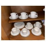 White China Cups/Saucers and Misc in Cabinet Base