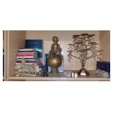 Shelf lot of assorted items to include a cupcake