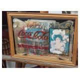 Vintage-style Coca-Cola advertising mirror.