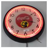 Vintage-style Coca-Cola advertising wall clock