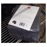 Pair of black foam yoga blocks still sealed
