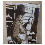 Sepia-toned art print features John Wayne
