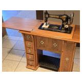 Antique Singer Sewing Machine in Hide-Away Cab.