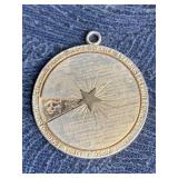 VINTAGE MONET GOLD TONED MOVEABLE ZODIAC