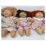 3 1985 Cabbage Patch Girl Dolls , Red, Brown &