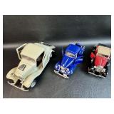 Trio of Cast Collectible Cars