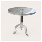 ROUND SIDE TABLE IN ACRYLIC ON A PEDESTAL BASE.