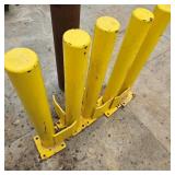 Four Yellow Steel Safety Bollards