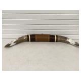 CATTLE/STEER HORNS WRAPPED IN LEATHER ON WALL