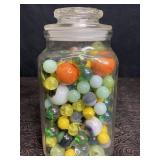 GLASS JAR FULL OF MARBLES