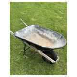 PLASTIC WHEEL BARREL W/ CRACK IN BOTTOM