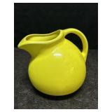 YELLOW TILTED POTTERY WATER PITCHER
