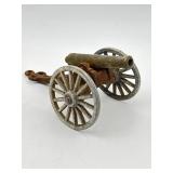VINTAGE MINIATURE BRASS CANNON ON CAST-IRON