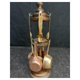 COPPER MEASURING CUPS & SPOONS ON WOOD RACK