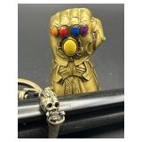 SILVER TONE HAND HOLDING SKULL RING & AVENGERS