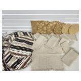 CLOTH PLACEMATS, NAPKINS & WOVEN RATTAN HOT PADS.