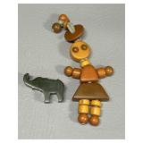 Vintage Bakelite Girl Crib Toy & Green Elephant