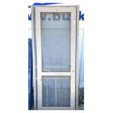 Several primitive screen doors