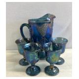 Carnival glass, pitcher, and glasses