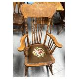 Antique wooden rocker with floral design