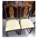 2 wooden cushioned seat chairs
