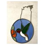 stained glass suncatcher featuring a hummingbird.