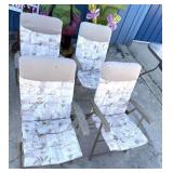 Four cushioned deck chairs