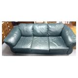 Weather couch some ware (tear patched)