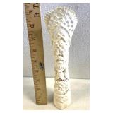 hand-carved totem made from bleached bovine bone,